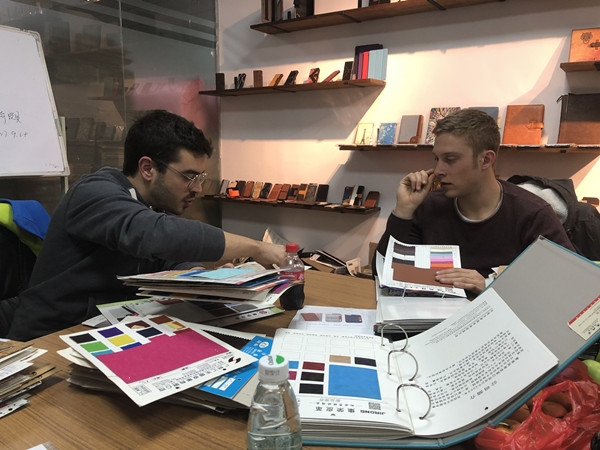 Handsome clients come to our factory to discuss the details with our colleague.